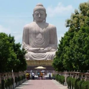 Great Buddha Statue in Bodhgaya surrounded by greenery and a landscaped pathway