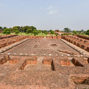 Panoramic view of ancient Nalanda University ruins surrounded by greenery