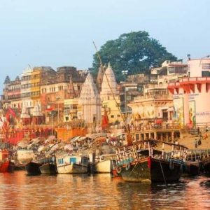 Varanasi ghats on the River Ganges with temples, traditional boats and riverside buildings